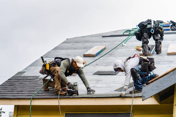 Professional Gutter Installation technician working in Woodmere, LA